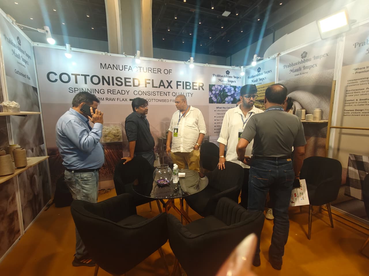 Visitors interacting with Prabhavishnu Impex exhibition booth